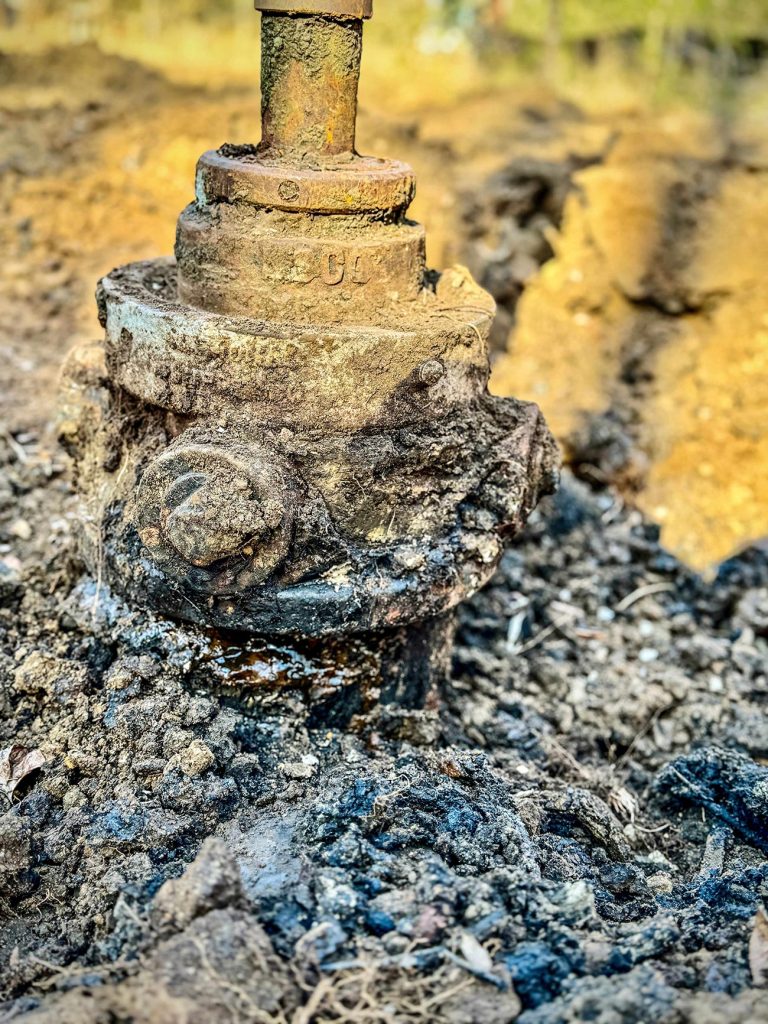 A large old oil well getting plugged