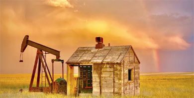 old building next to an abandoned oil well