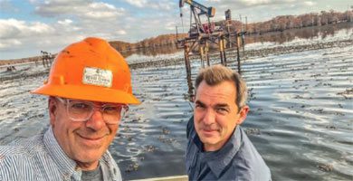 Curtis Shuck evaluating a well in water